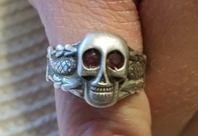 Silver skull ring with stones in the eyes